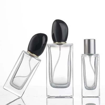 Pudełko z perfumami z szkła kwadratowego o pojemności 50 ml, pojemności 100 ml i charakterystycznej, nieregularnej kształcie pokrywki